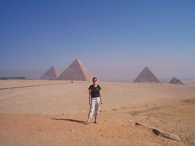 Melanie in front of the three pyramids at Giza
